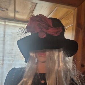 Elegant Black Hat with Pink Floral Accent